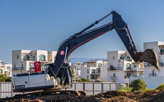Excavator digging soil at a construction site 7