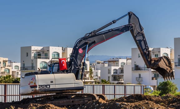 Excavator digging soil at a construction site 6