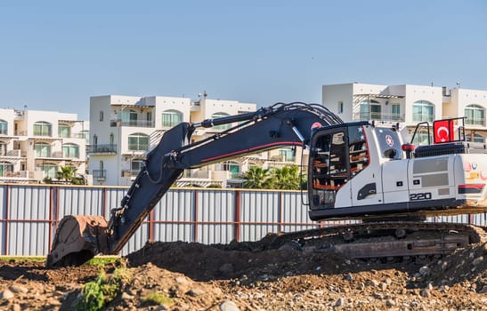Excavator digging soil at a construction site 5