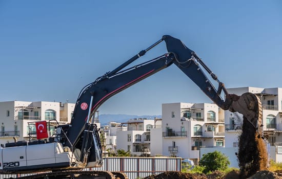 Excavator digging soil at a construction site 4