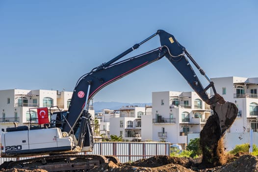 Excavator digging soil at a construction site 3
