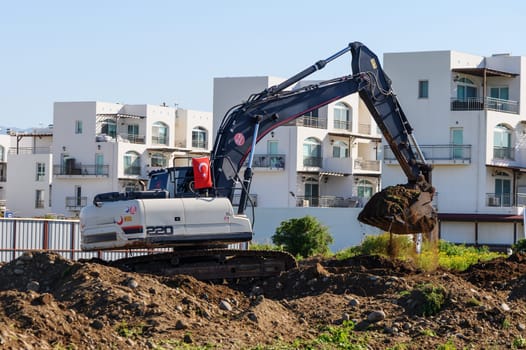 Excavator digging soil at a construction site