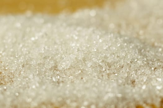 Close Up Locked Down Shot of White Sugar Crystals Falling Off Spoon. Closeup Macro