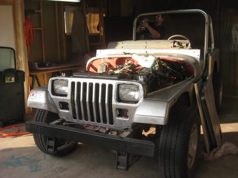 Restoring a 1990s Car, Auto Body Repair and Repainting Prep Work. High quality photo
