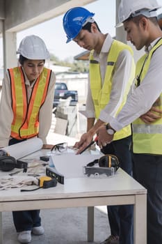 Engineer Teamwork Meeting, Drawing working on blueprint meeting for project working with partner on model building and engineering tools in working site, Construction and structure concept..