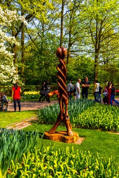 Lisse South Holland Netherlands 04. April 2014 Metal and wooden statue sculpture figure in the park in Keukenhof Lisse South Holland Netherlands Holland in Europe.