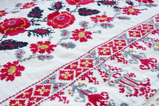 Vintage ethnic Ukrainian embroidery on oldfabric.