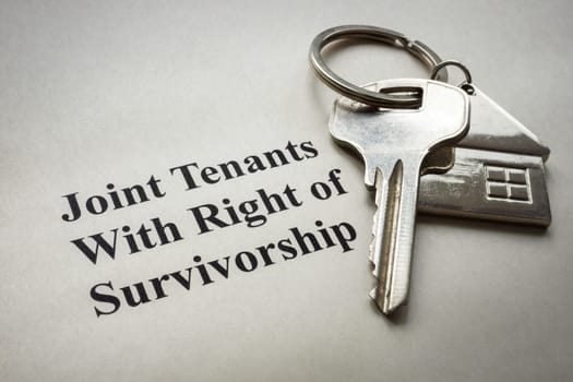 Key lie on paper with mark Joint tenants with right of survivorship.