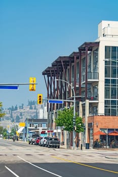 City street view with modern residential building on site.