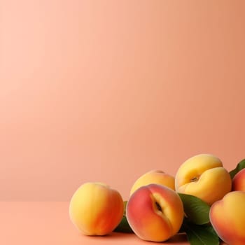 Fresh peaches with leaves on pink background.