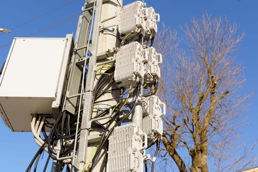 A tower with various wires and cables attached to it, creating a network of connections and pathways.