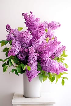 A bouquet of beautiful fragrant lilacs in a vase. AI generated.