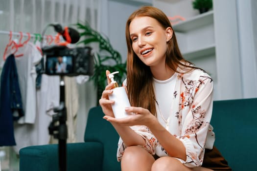 Woman influencer shoot live streaming vlog video review makeup utmost social media or blog. Happy young girl with cosmetics studio lighting for marketing recording session broadcasting online.