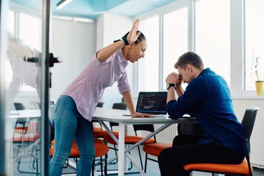 A furious business director of a startup office berating her employee for business mistakes and errors.