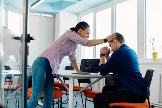 A furious business director of a startup office berating her employee for business mistakes and errors.