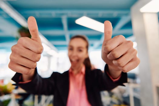 Closeup of hands, Smiling Business Woman Making Frame Gesture with at modern bright coworking open space startup office.