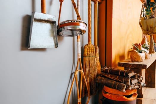 Image of Household utensils hanging on the wall in the kitchen.