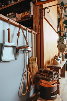 Image of Household utensils hanging on the wall in the kitchen.