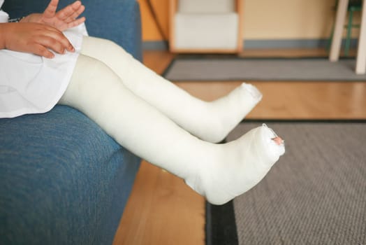 little child boy with plaster bandage on leg
