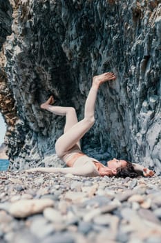 Happy young attractive brunette woman in red swimsuit, on the beach and sea background. Holiday vacation and travel concept.