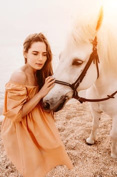 A white horse and a woman in a dress stand on a beach, with the sky and sea creating a picturesque backdrop for the scene