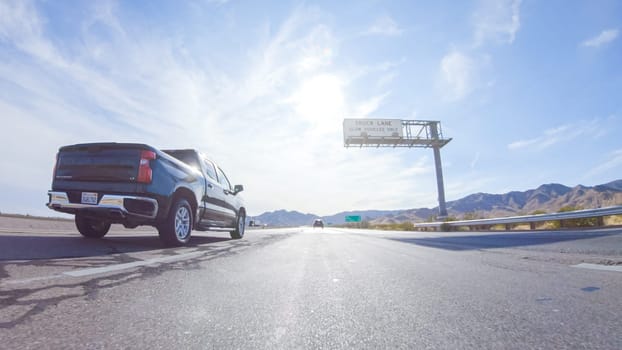 HWY 15, California, USA-December 3, 2022-Embarking on a road trip from Nevada to California, driving on Highway 15 during the day offers scenic views and an exciting journey between states.