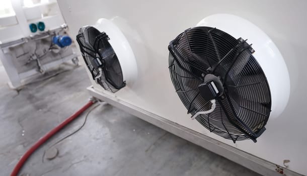 Industrial fans for large air conditioner in production room. Operation of ventilation equipment concept