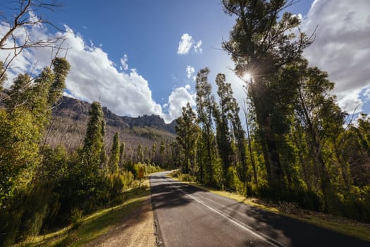 The picturesque Gordon River Rd and the Needles mountain range near Florentine on a hot summer's afternoon in Southwest National Park, Tasmania, Australia