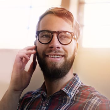 Happy man, phone call and vision with glasses in discussion, communication or networking at home. Face of male person or freelancer with smile on mobile smartphone for friendly conversation at house.