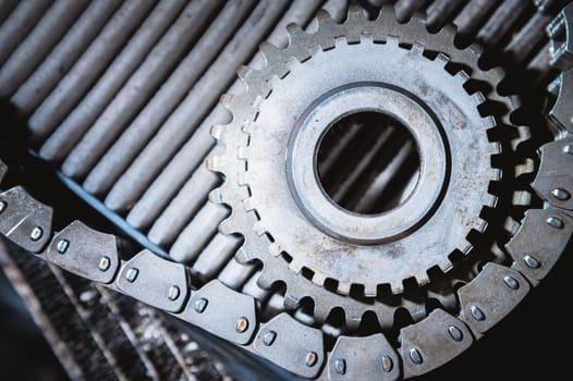 Transmission chain on a gear. Disassembled car transfer case.