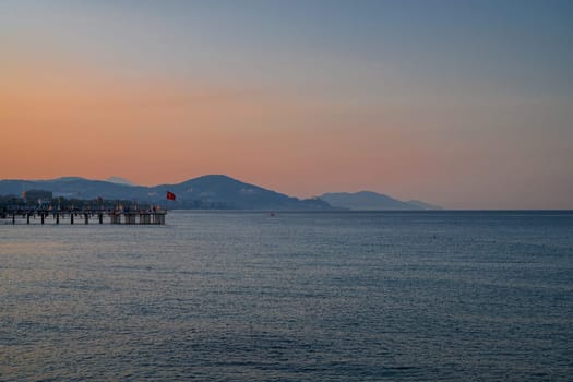 Beautiful sunrise scene on Alanya beach with view to famous Alanya island, in Turkey