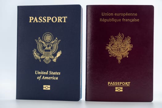 1 United States and 1 France passport on transparent background. Concept of business, trade, employment, vacation travel. Concept coming summer Olympics. Straight on closeup, photo high quality photo.