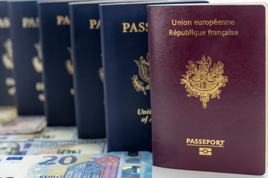 United States and France passports on currency transparent background. Low camera angle. Concept of business, trade, employment, vacation travel. Concept coming summer Olympics. Closeup, selective focus photo high quality photo.