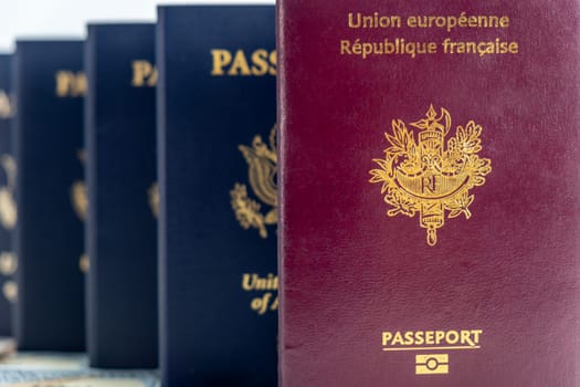 United States and France passports on currency and transparent background. Concept of fellowship, business, trade, employment, vacation travel. Concept coming summer Olympics. Closeup, selective focus photo high quality photo.