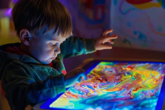 A young boy with autism is absorbed in a tactile sensory activity, using his hands to explore and create. The vibrant colors highlight the sensory stimulation and learning experience