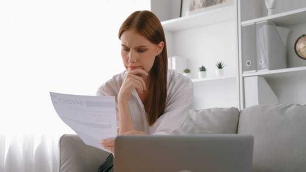 Stressed young woman has financial problems with credit card debt to pay prim from bad personal money and mortgage pay management crisis. Woman worry about financial bankruptcy risk from over spending