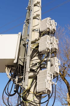 A tower with various wires and cables attached to it, creating a network of connections and pathways.