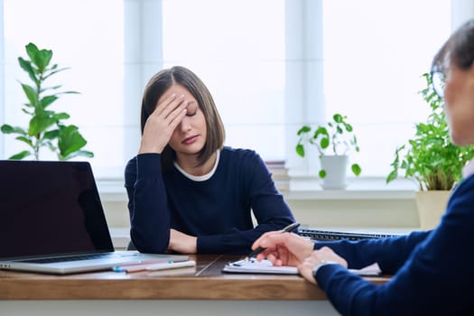 Sad unhappy young woman patient at session with female psychologist therapist social worker counselor psychotherapist. Mental health professional support treatment, feelings stress depression trauma