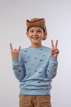 portrait of a boy in a cowboy hat on a white background 1