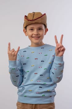 portrait of a boy in a cowboy hat on a white background 2