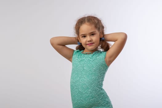 studio portrait of a charming little girl on a white background 10