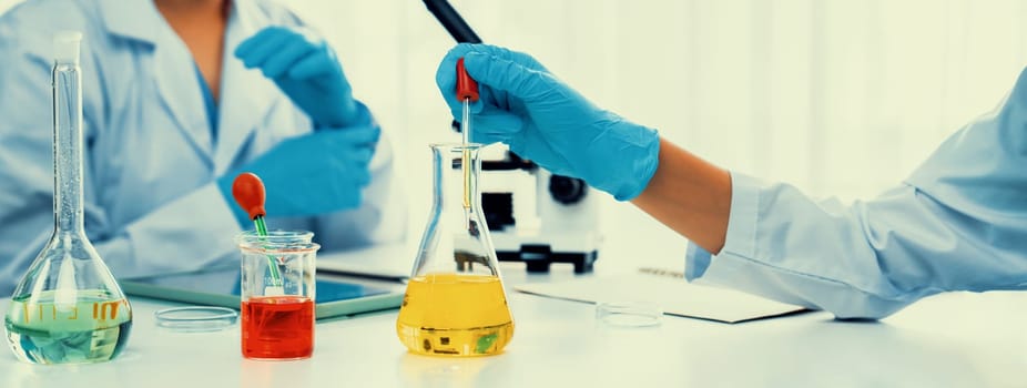 Laboratory researcher team advance healthcare with scientific expertise and laboratory equipment, researching new medicines and developing cure in the lab. Panorama Rigid