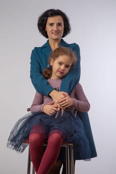 mother and daughter studio portrait happy family 1