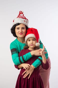 mother and daughter new year studio portrait happy family
