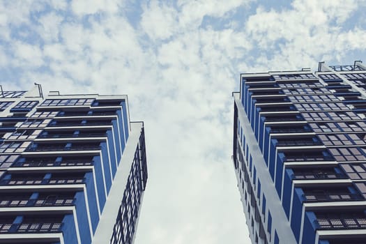 Minsk, Belarus - August  2019. Facade of the new residential high-rise buildings against the sky . 