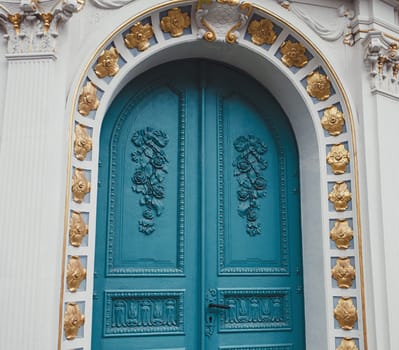 blue carved wooden door of the Church