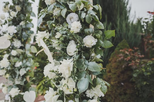 element of the wedding arch made of fresh flowers. close-up of floral decor