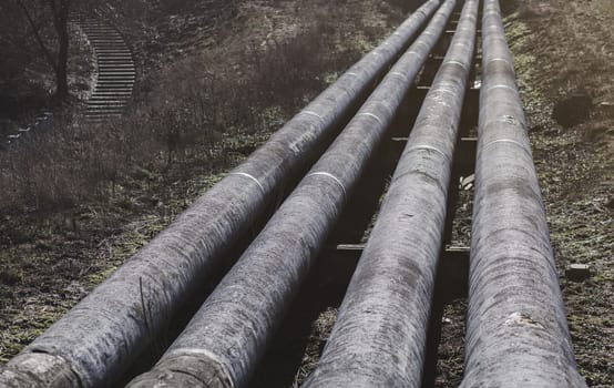 long concrete industrial pipes in the city