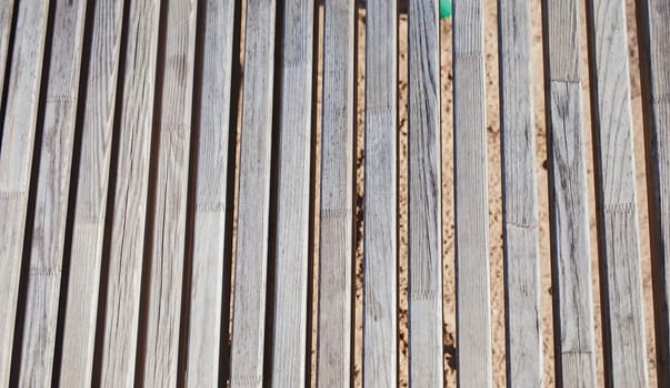 old wooden bench on the city beach