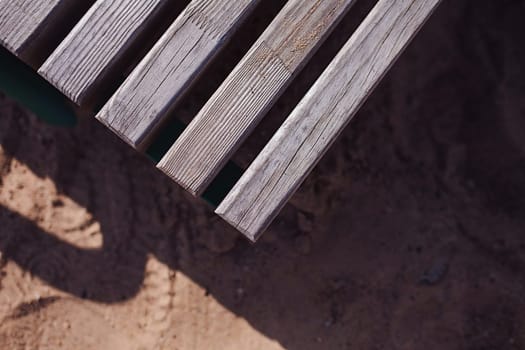 Corner of old wooden table or bench as its background 